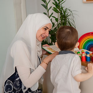 A teacher with a little boy at Smart Kids Day Nursery