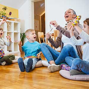 Children in a music lesson with teacher at Smart Kids Day Nursery